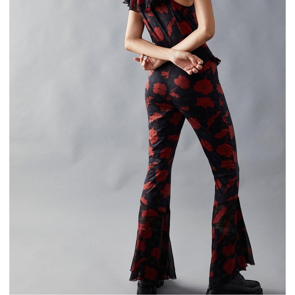 Free People Austyn one piece floral, ruffle, bell bottom jumpsuit.